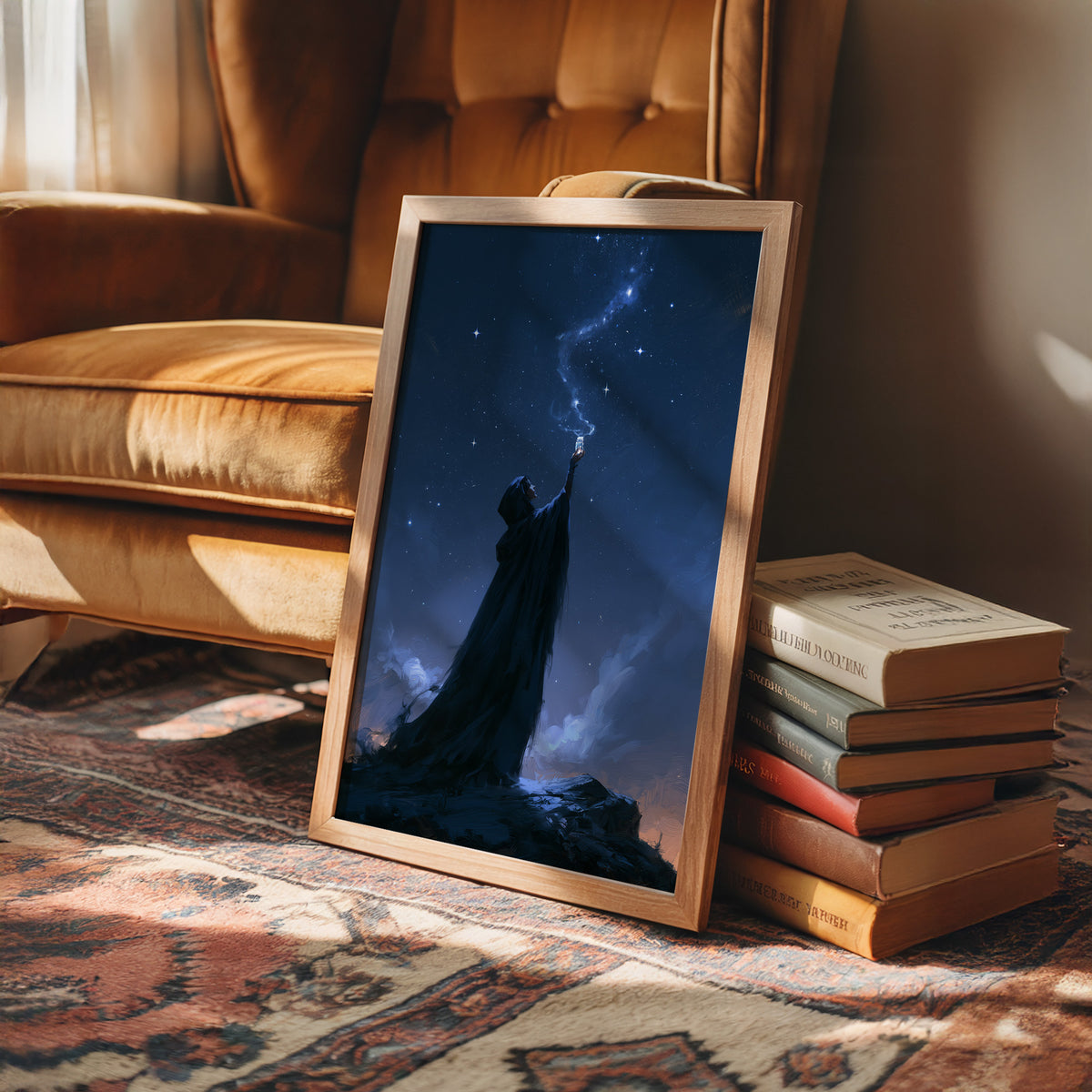 Reaching for the Starfall, a cloaked figure raising one arm toward a trail of light across a deep blue night sky, painted in midnight blue, indigo and pale silver, in a wood frame beside a leather armchair and a stack of books