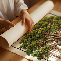 Roots That Remember the Ground, a banyan tree with a wide green canopy and many aerial roots hanging to the ground, drawn in a framed Japanese travel poster style with katakana above and BANYAN TREE below, as a matte poster, unframed