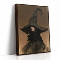She Keeps Her Own Counsel, a dark witch in a tall pointed hat and a cloak, in a sepia portrait with a gilt frame, as a framed canvas in a brown frame