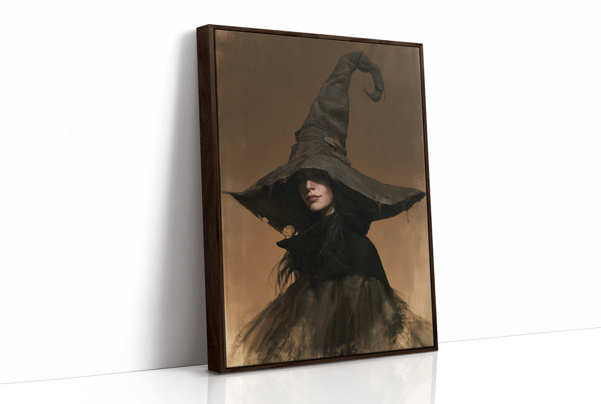She Keeps Her Own Counsel, a dark witch in a tall pointed hat and a cloak, in a sepia portrait with a gilt frame, as a framed canvas in a brown frame