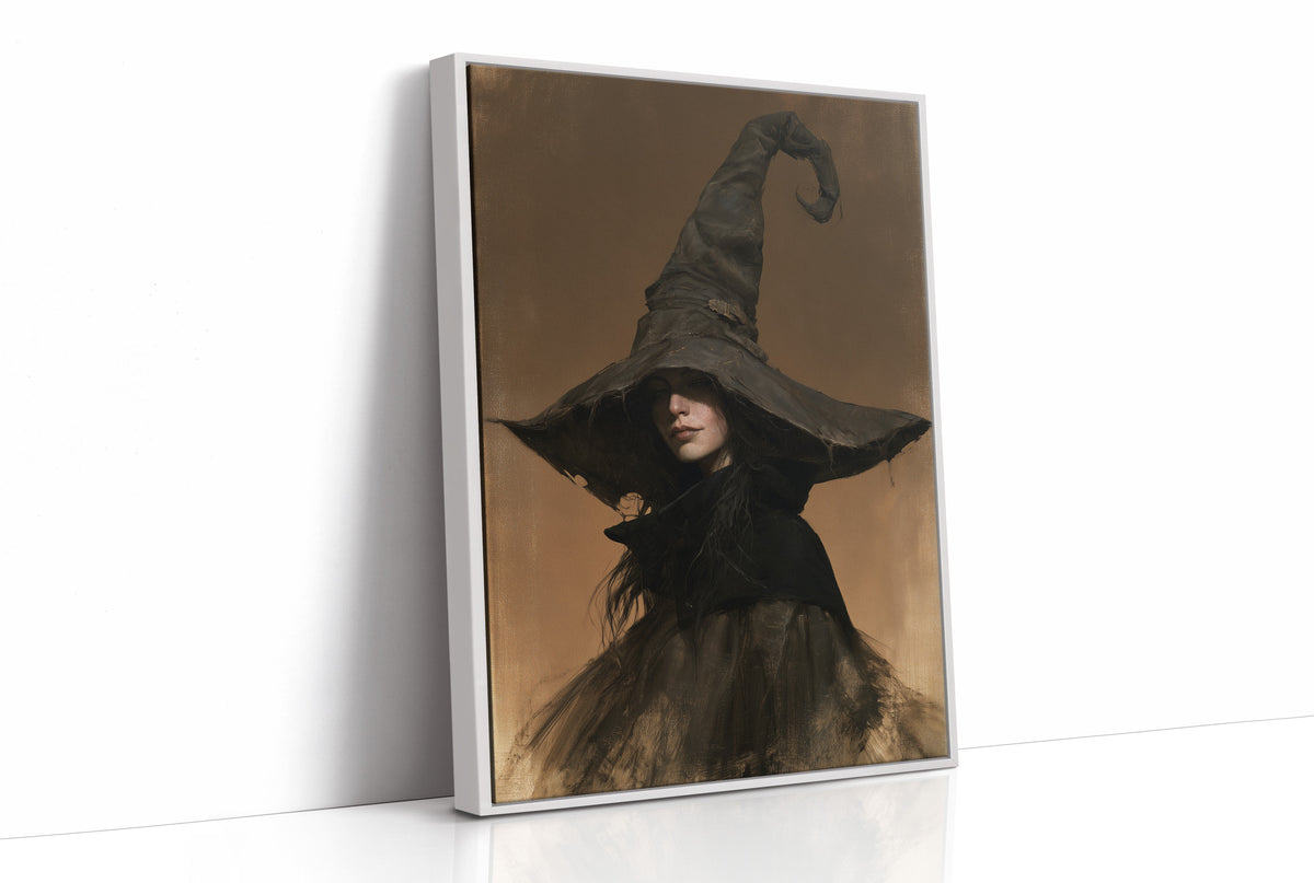 She Keeps Her Own Counsel, a dark witch in a tall pointed hat and a cloak, in a sepia portrait with a gilt frame, as a framed canvas in a white frame