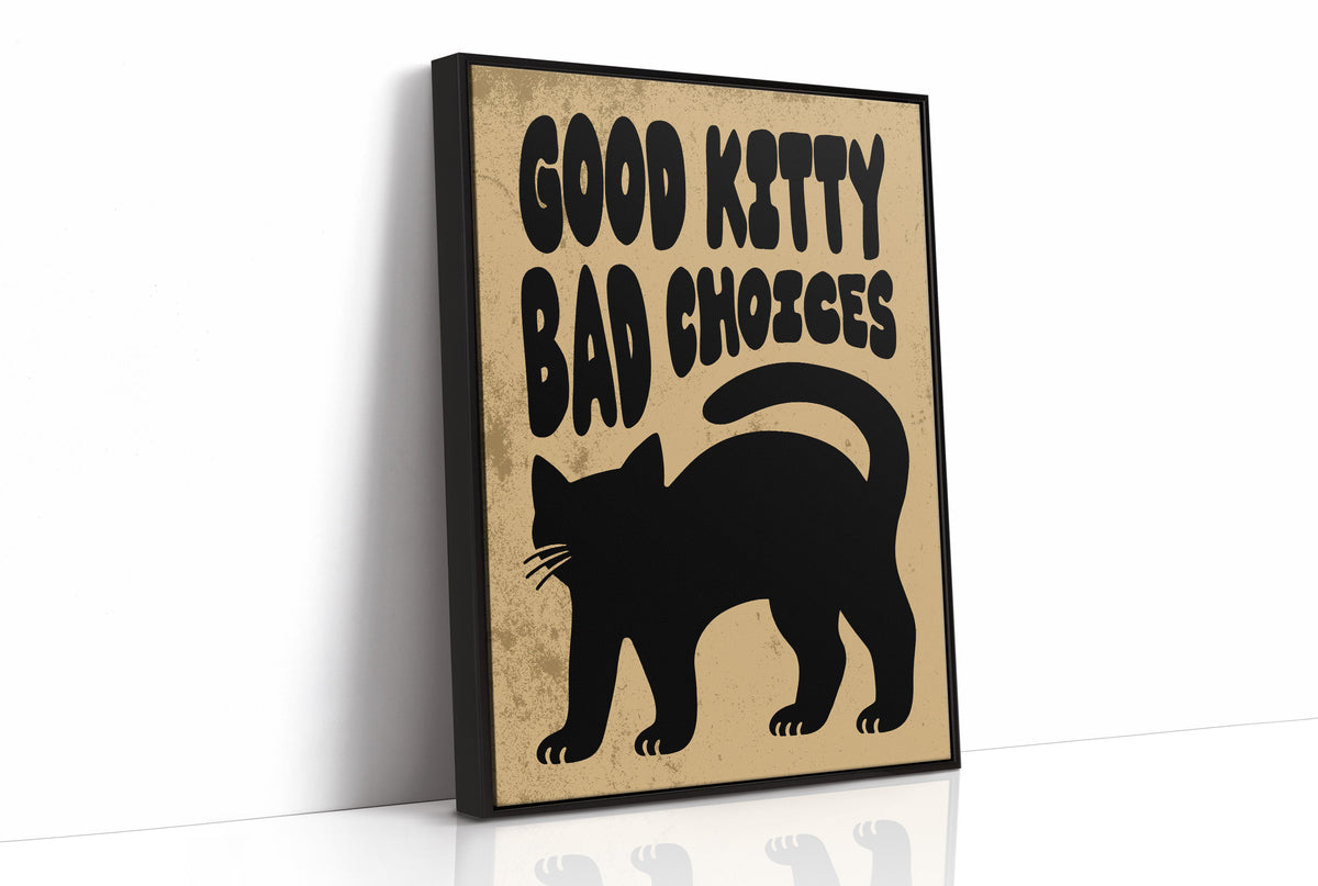 Sleek Silhouette, Questionable Taste, a solid black cat silhouette with a long tail curled up the side, standing on tan paper with the words GOOD KITTY BAD CHOICES in bold black lettering, as a framed canvas in a black frame