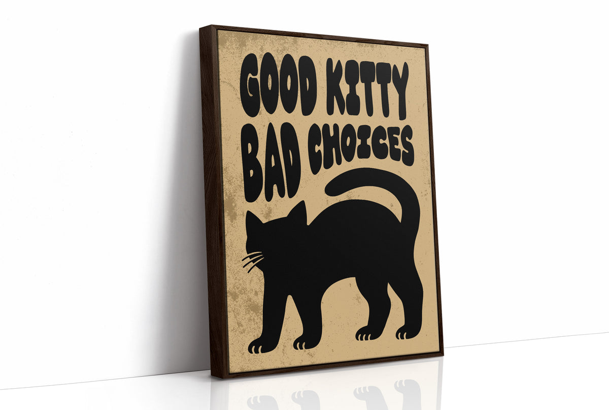 Sleek Silhouette, Questionable Taste, a solid black cat silhouette with a long tail curled up the side, standing on tan paper with the words GOOD KITTY BAD CHOICES in bold black lettering, as a framed canvas in a brown frame