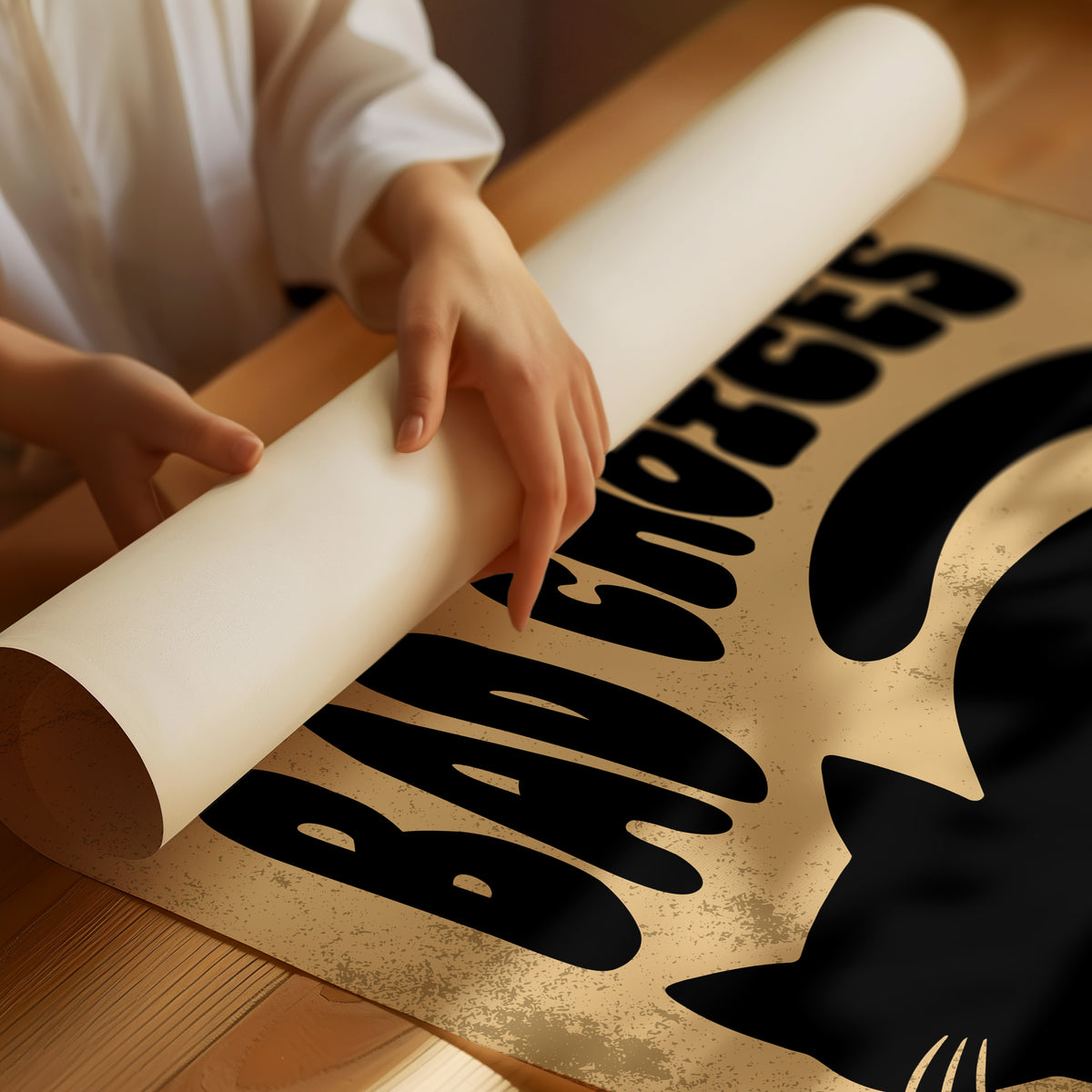 Sleek Silhouette, Questionable Taste, a solid black cat silhouette with a long tail curled up the side, standing on tan paper with the words GOOD KITTY BAD CHOICES in bold black lettering, as a matte poster, unframed