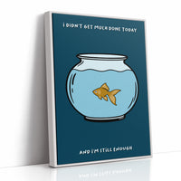 Still Enough for Today, a round glass fishbowl with one goldfish on a deep navy ground, a line of cream lettering above and below in a cartoon style, painted in navy, pale blue and orange, as a framed canvas in a white frame