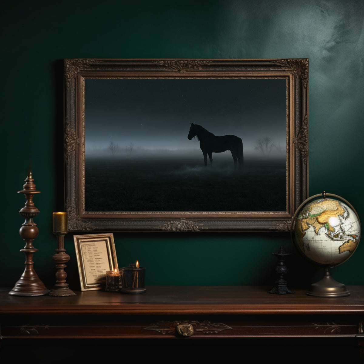 Still Ground Before Morning, a dark horse standing alone in a field where fog has swallowed the horizon, a faint silver light spilling across the mist, in an ornate dark frame on a deep green wall above a mantel with a globe and candles