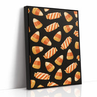 Stripes Kept for Later, a repeating pattern of candy corn kernels in cream, orange and butter yellow on a deep black ground, as a framed canvas in a black frame