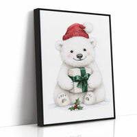 The Bear Cub Keeps a Secret, a small polar bear cub in a red knit hat hugging a green wrapped gift with a sprig of holly at its feet, on a soft cream ground, as a framed canvas in a black frame