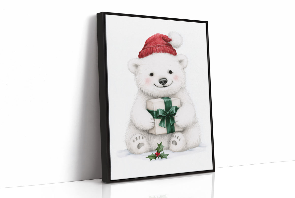 The Bear Cub Keeps a Secret, a small polar bear cub in a red knit hat hugging a green wrapped gift with a sprig of holly at its feet, on a soft cream ground, as a framed canvas in a black frame