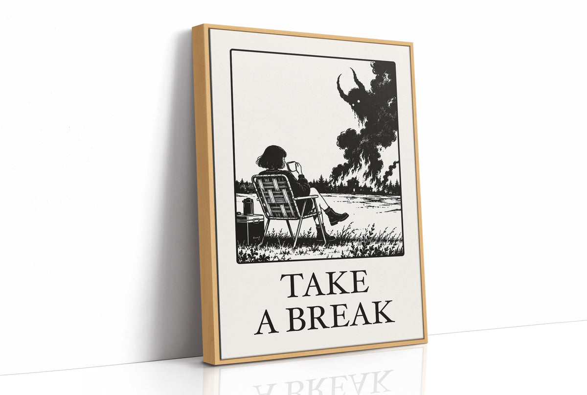 The Break Nobody Schedules, a figure in a deck chair under a broad tree in a black and cream line scene, with TAKE A BREAK in large serif capitals beneath, as a framed canvas in a natural wood frame