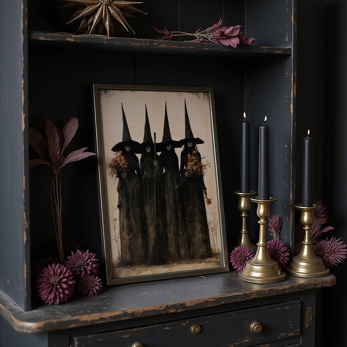 The Coven Keeps Its Silence, five witches in tall pointed hats standing shoulder to shoulder, painted in black, charcoal and dusty cream, on a dark cabinet shelf beside black candles and dried flowers