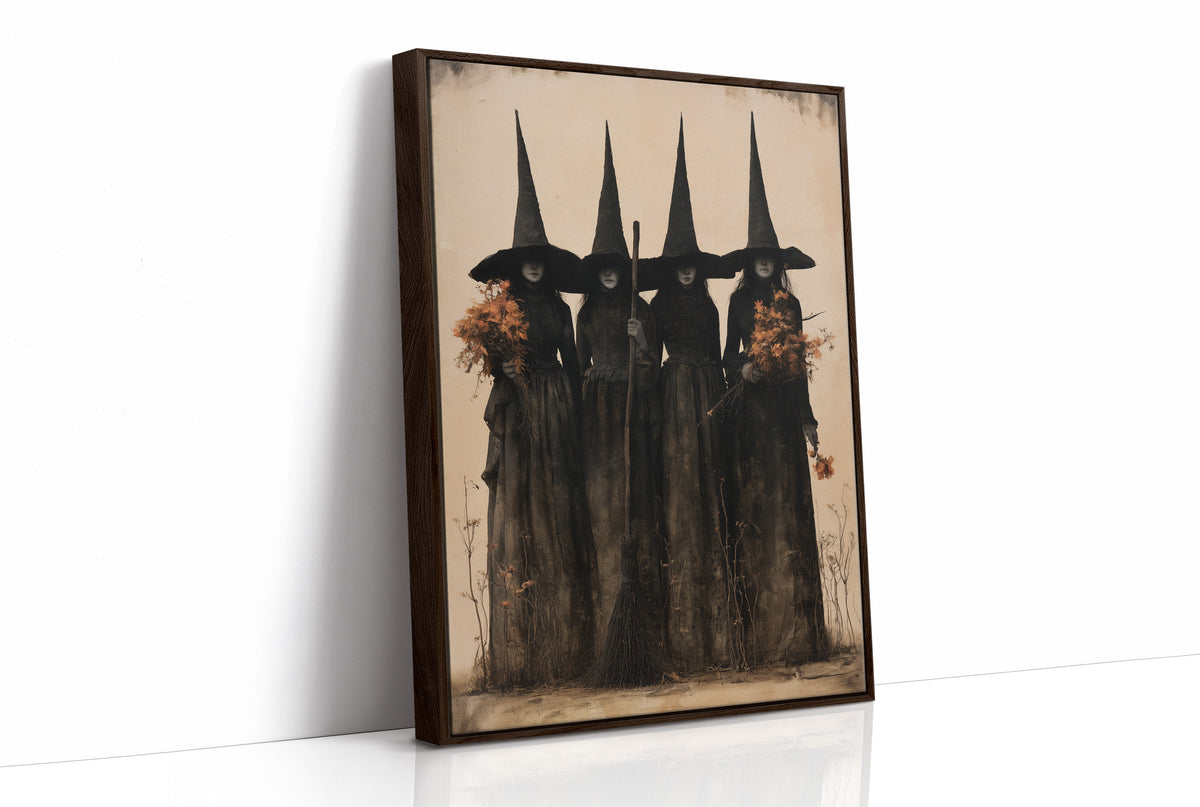 The Coven Keeps Its Silence, five witches in tall pointed hats standing shoulder to shoulder, painted in black, charcoal and dusty cream, as a framed canvas in a brown frame
