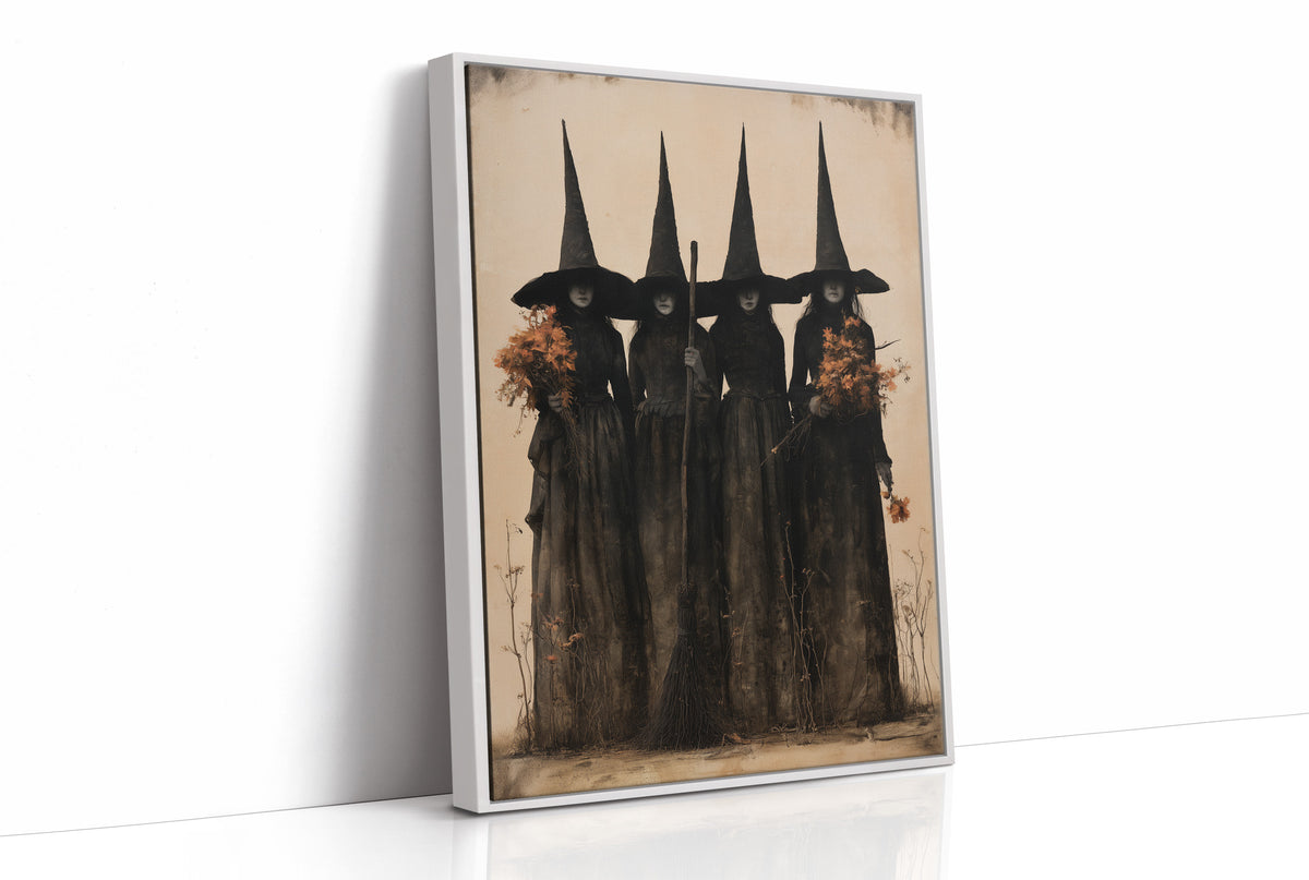 The Coven Keeps Its Silence, five witches in tall pointed hats standing shoulder to shoulder, painted in black, charcoal and dusty cream, as a framed canvas in a white frame