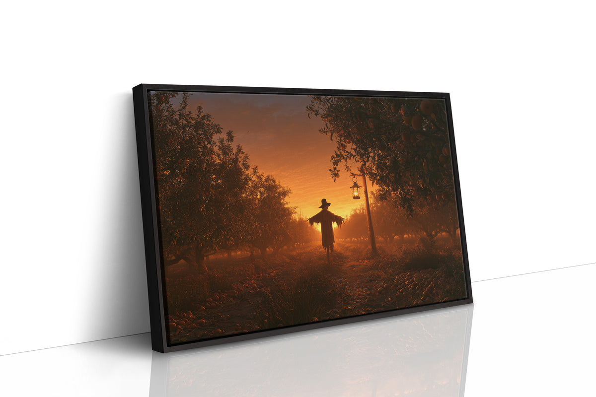 The Field Keeps Its Last Light, a scarecrow standing in a rural sunset field of amber sky and rust colored grass, painted in burnt orange, dusky gold and deep brown, as a framed canvas in a black frame