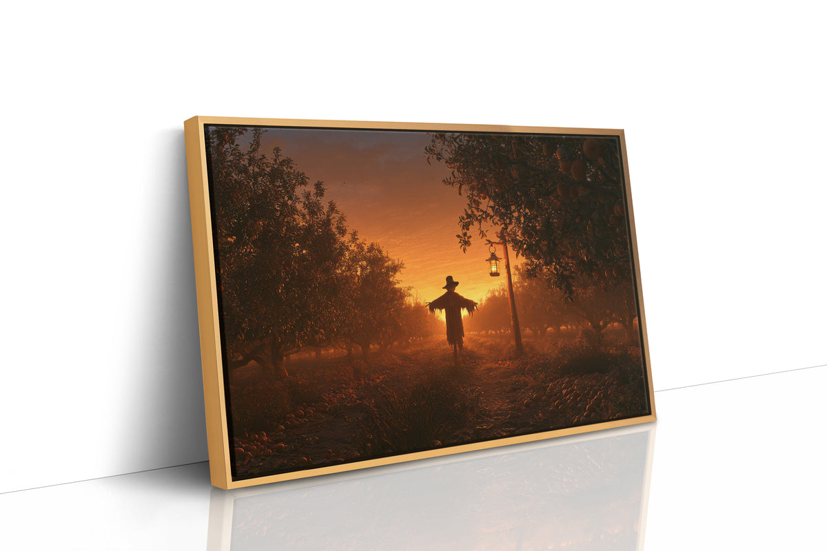 The Field Keeps Its Last Light, a scarecrow standing in a rural sunset field of amber sky and rust colored grass, painted in burnt orange, dusky gold and deep brown, as a framed canvas in a natural wood frame