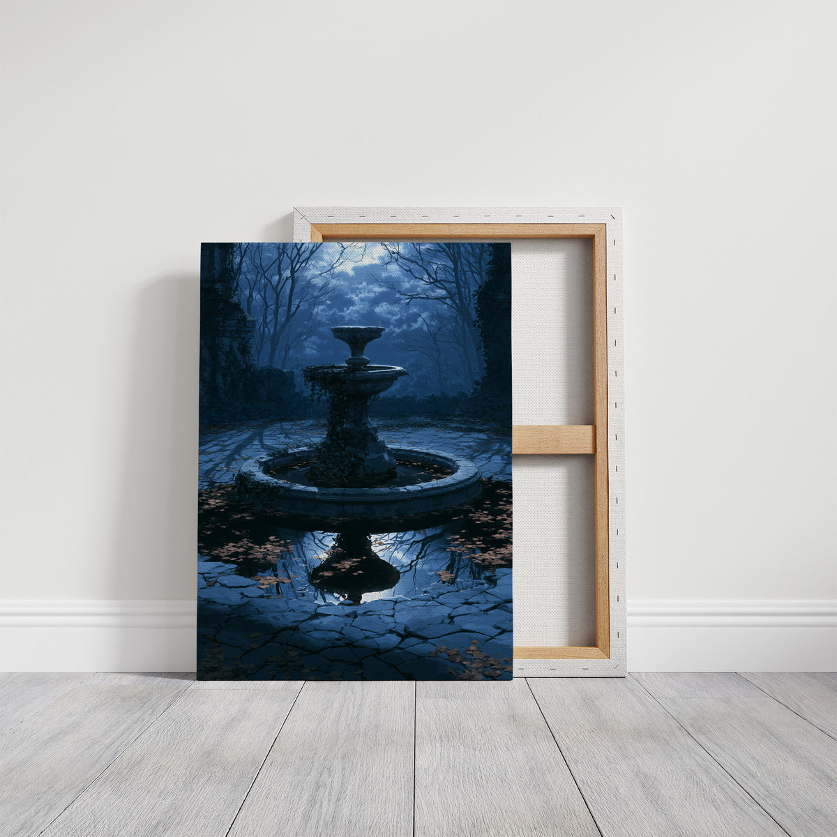 The Fountain Holds Its Breath, moonlit garden fountain painting in deep blue, on a gallery canvas with wrapped edges leaning against a white wall