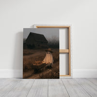 The Gentle Ghost Keeps the Farm, a small ghost in a straw hat pushing a wheelbarrow of pumpkins down a dirt farm road past an old barn, painted in dusky brown, gray and a pale ghostly glow, on a gallery canvas with wrapped edges leaning against a white wall