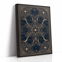 The Gilded Wheel of Midnight, a gold ornamental mandala of moon phases and stars on a deep navy field, painted in navy and antique gold, as a framed canvas in a black frame