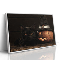 The Keeper of Lantern Night, a black cat beside a glowing carved pumpkin wearing a witch hat, painted in deep brown, burnt orange and candle gold, as a framed canvas in a white frame