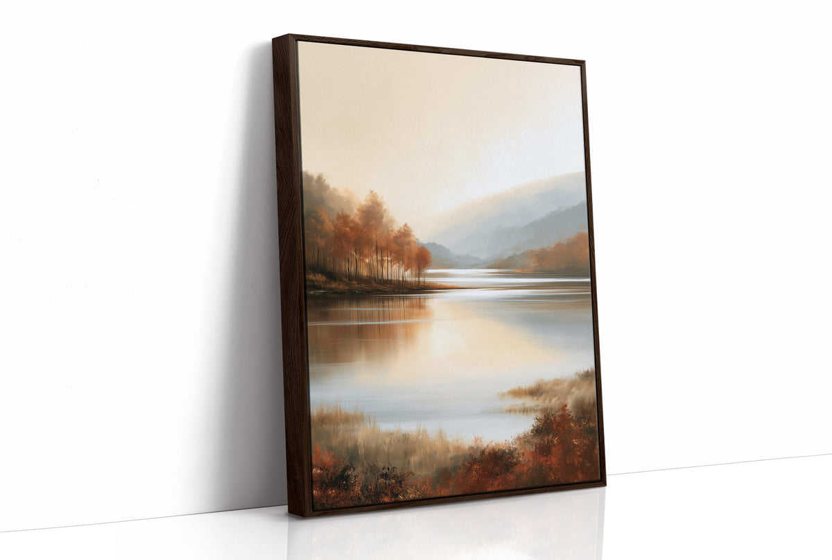 The Lake Remembers Autumn, an autumn lake at dusk with a line of turning trees on the near shore and pale mountains beyond, the water mirroring the sky in soft blue and amber, as a framed canvas in a brown frame