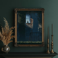 The Last Light Left Upstairs, a dark blue house at night with one lit upstairs window, a fence and tall grass in the foreground, midnight blue palette, in an ornate gold frame on a deep green wall beside brass candlesticks
