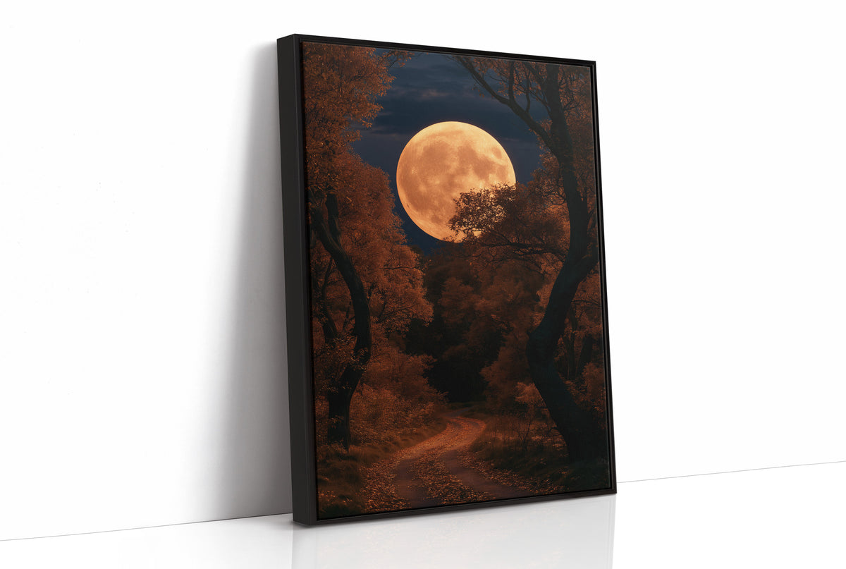 The Long Road Turns Amber, huge amber harvest moon over a dark forest road painting, as a framed canvas in a black frame