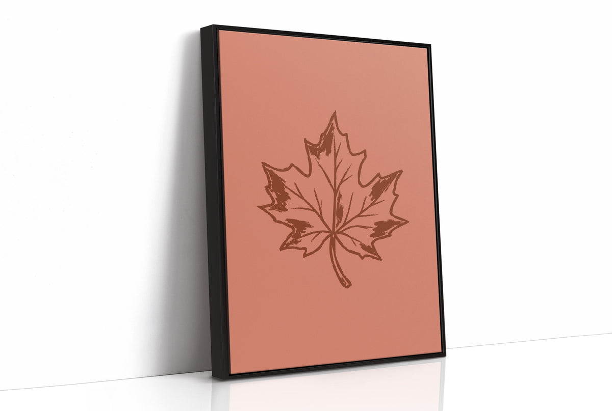 The Maple Keeps Its Last Light, a single maple leaf drawn in fine brown outline on a dusty terracotta ground, a botanical line study with soft shading, as a framed canvas in a black frame