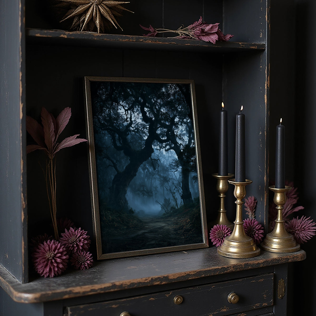 The Old Oak Keeps Its Midnight, gnarled trees rising out of a blue mist on a moonlit night, painted in deep navy, pale fog and charcoal shadow, on a dark wooden cabinet shelf with candles and dried flowers