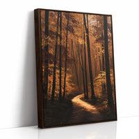The Path Bends Toward Home, an autumn forest path winding between tall dark trunks, lit by a shaft of golden light across the leaves, painted in rust, amber and deep brown, as a framed canvas in a brown frame