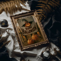 The Pumpkin Keeps Its Hat On, a grinning jack o lantern wearing a witch hat on a weathered sign that reads happy halloween, with pumpkins and cornstalks, painted in burnt orange, black and aged cream, in an antique gold frame laid on white linen with ferns and a pocket watch