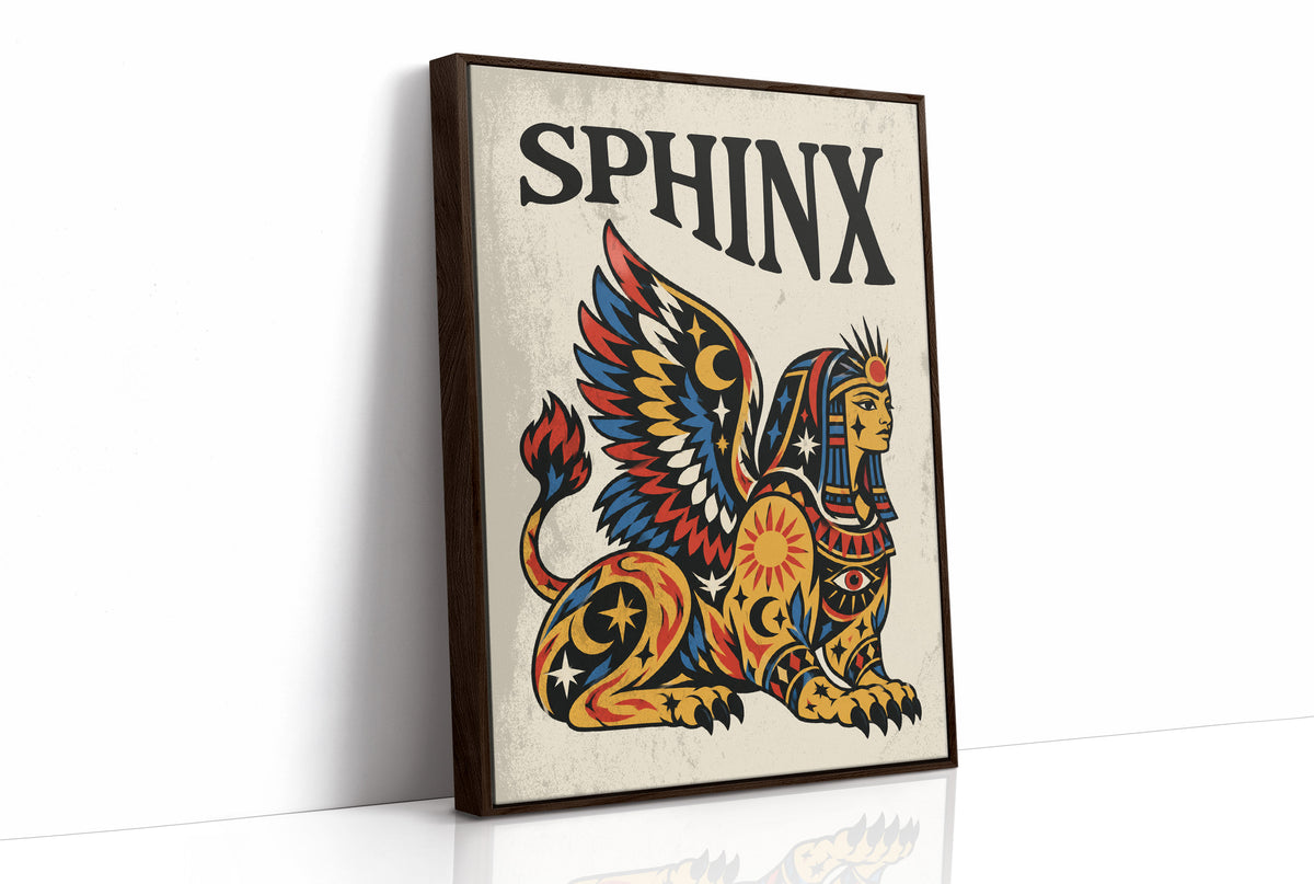 The Sphinx Keeps Her Riddle, a winged sphinx seated with folded wings in gold, red and blue, painted in bold black outlines on a cream paper ground beneath bold black lettering, in a traditional tattoo flash style, as a framed canvas in a brown frame
