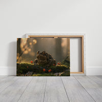 The Toad Holds Court in the Moss, toad sitting on mossy ground beside red mushrooms in warm dusk light painting, on a gallery canvas with wrapped edges leaning against a white wall