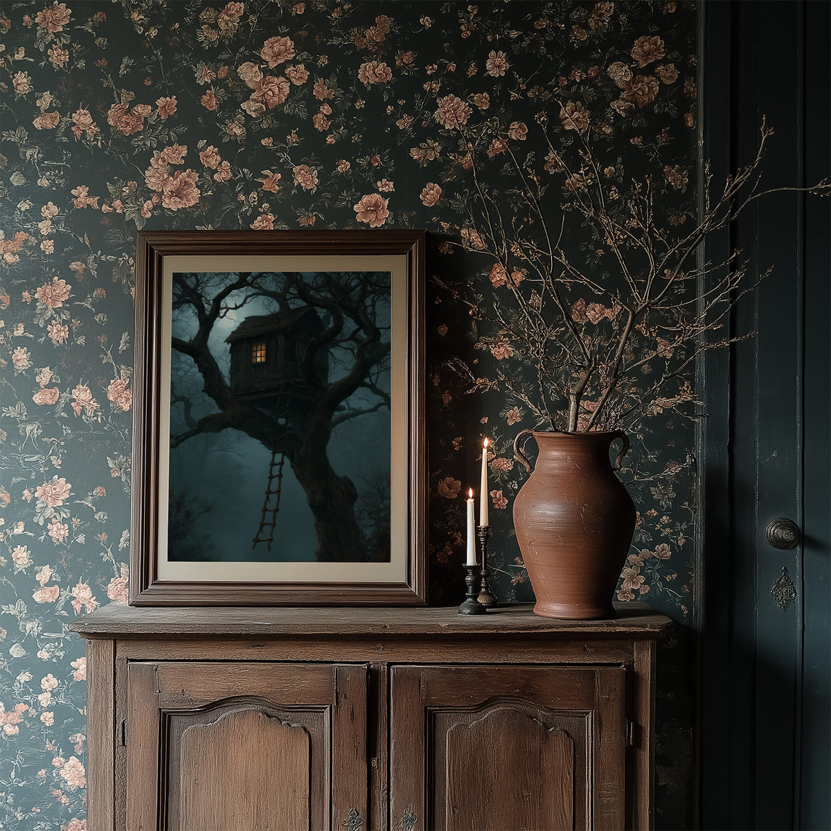 The Treehouse Never Sleeps, a glowing treehouse window high in a twisted oak under a blue fog of night, painted in deep teal and fog blue, in a dark frame on a wooden dresser against floral wallpaper