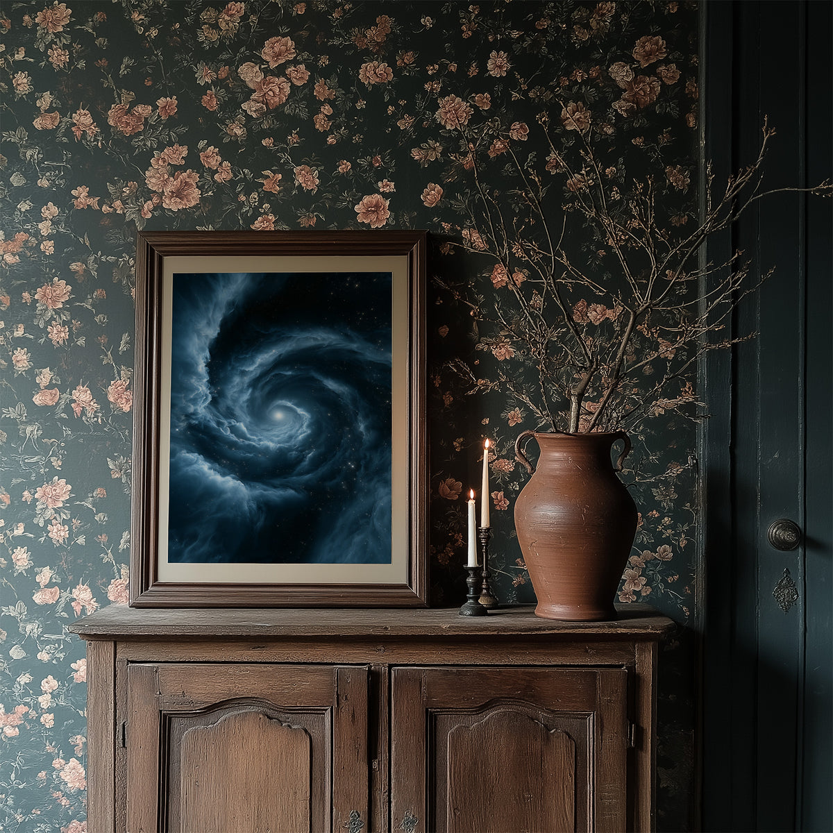 The Turning Sky Remembers, a slow silver spiral of blue light turning through a deep dark field toward one bright center, in a dark frame on a wooden dresser against floral wallpaper