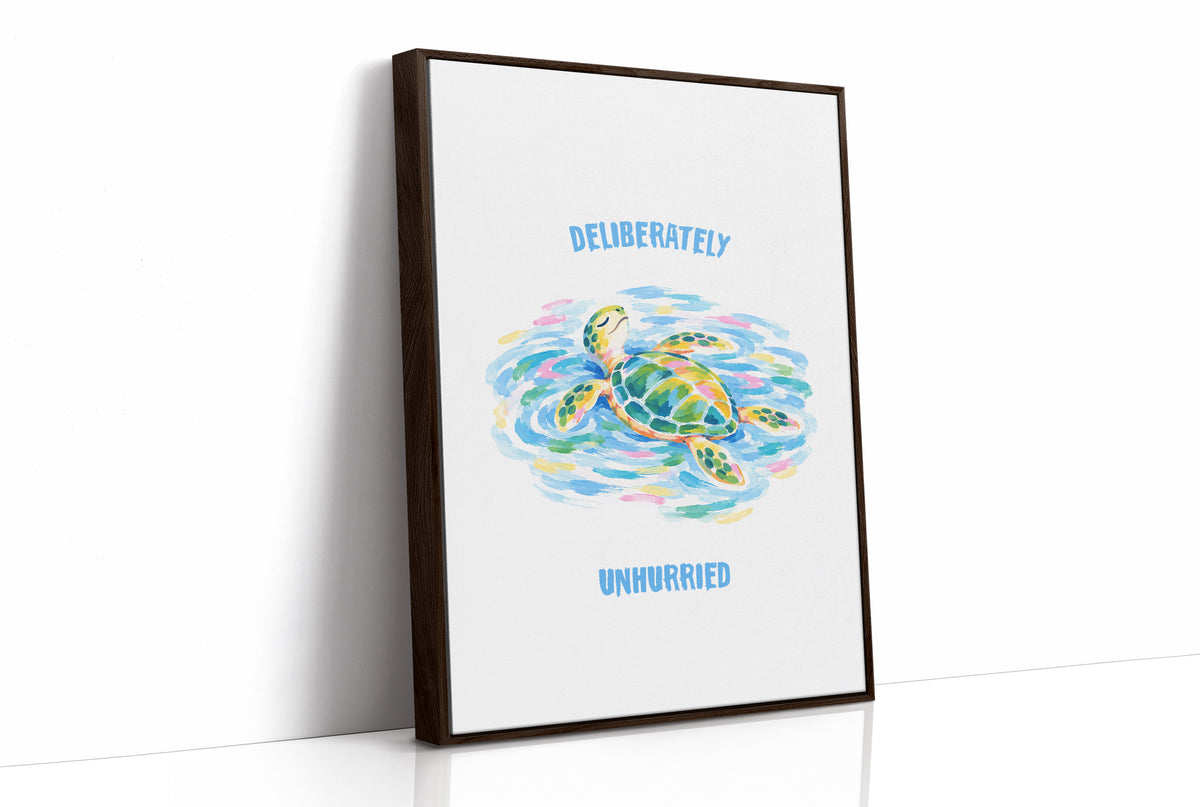 The Turtle Keeps Its Own Time, a sea turtle drifting over pale blue and green watercolor waves, with two lines of bold blue lettering above and below it on a white ground, in a soft watercolor style, as a framed canvas in a brown frame