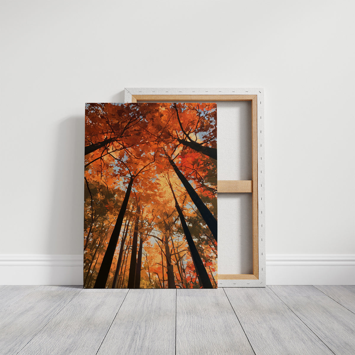 The Woods Blaze Overhead, a looking up view of tall trees with fiery red and orange autumn canopy and a sky of soft light, painted in flame red and burnt gold, on a gallery canvas with wrapped edges leaning against a white wall