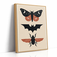 Three Night Visitors in a Row, a moth with crescent moon spots, a black bat in flight and a beetle with rust wings stacked in a column on a cream ground, painted in black, rust and cream, as a framed canvas in a natural wood frame