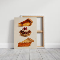 Three Slices Keep the Table Company, three pies stacked down the page, a golden custard slice, a pecan tart with cherries and a pumpkin wedge, on a cream ground, on a gallery canvas with wrapped edges leaning against a white wall