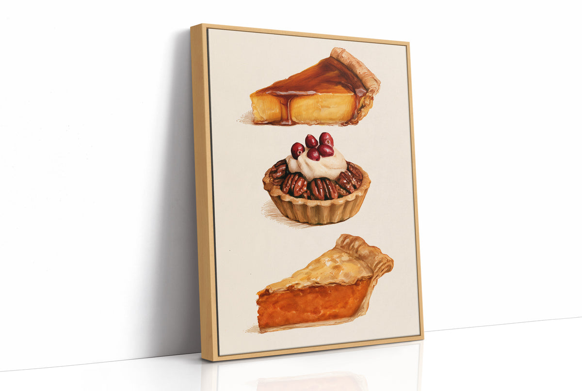 Three Slices Keep the Table Company, three pies stacked down the page, a golden custard slice, a pecan tart with cherries and a pumpkin wedge, on a cream ground, as a framed canvas in a natural wood frame