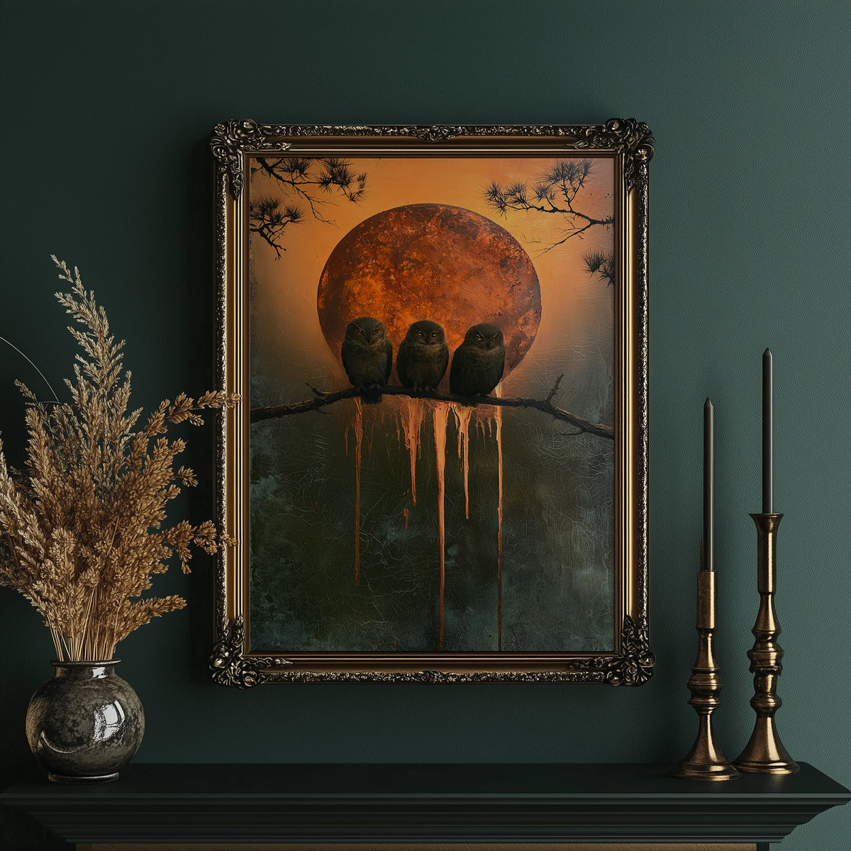 Three Watchers and the Moon, three black crows on a bare branch before a huge orange moon with gold paint dripping down the canvas, in an ornate gold frame on a deep green wall beside brass candlesticks