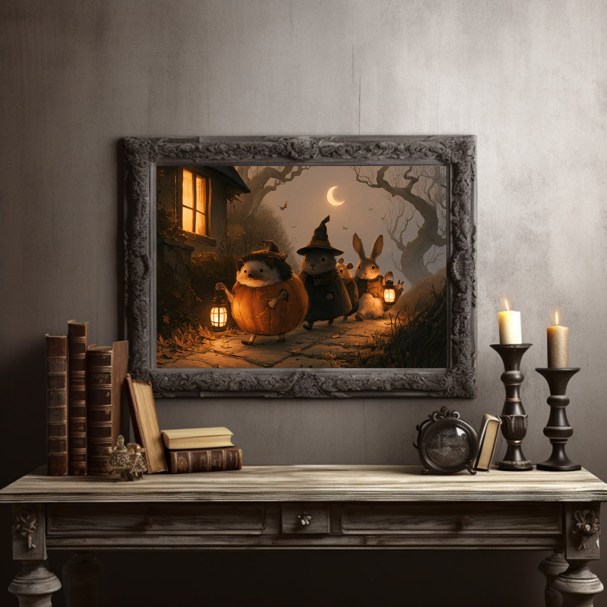 Trick or Treaters of the Hollow, small woodland creatures in witch hats with lanterns near a glowing cottage, in a dark carved frame on a gray wall above a console table with candlesticks and old books