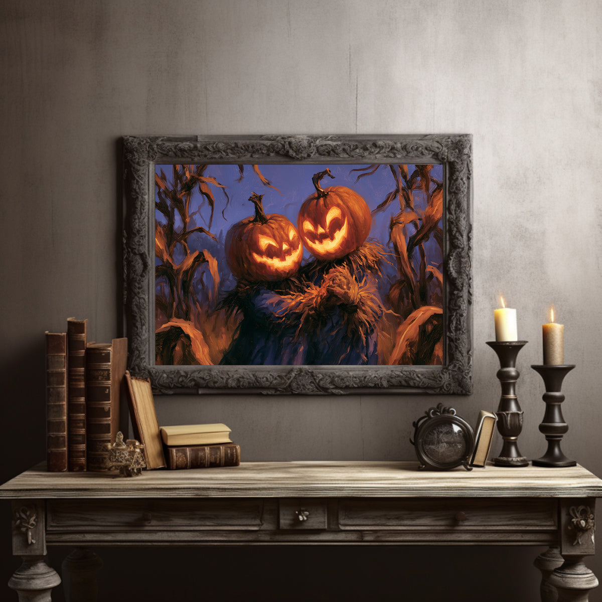 Two Lanterns Keeping Watch, two carved pumpkins glowing at the end of a cornfield under a deep blue dusk, painted in indigo, cornfield gold and warm orange, in a dark carved frame on a gray wall above a console table with candlesticks and old books