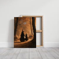 Two Witches on the Amber Path, two witch silhouettes walking a forest path between tall trees, glowing haze and a pale starry cluster above, painted in amber, umber and deep shadow, on a gallery canvas with wrapped edges leaning against a white wall