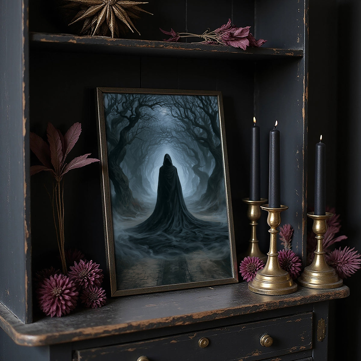 Veiled Beneath the Bending Trees, a hooded robed figure standing at the end of a tunnel of bare trees in pale blue fog, on a dark wooden cabinet shelf with candles and dried flowers