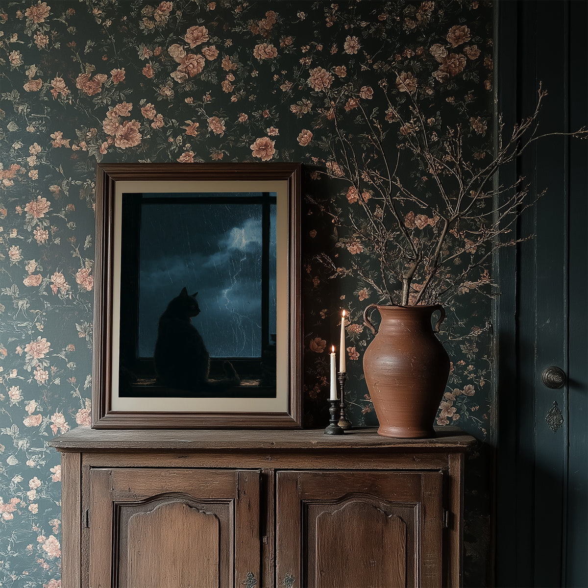 Waiting Out the Lightning, a black cat seated in silhouette before a window of blue night sky with distant lightning, painted in midnight blue, slate and cool silver, in a dark frame on a wooden dresser against floral wallpaper