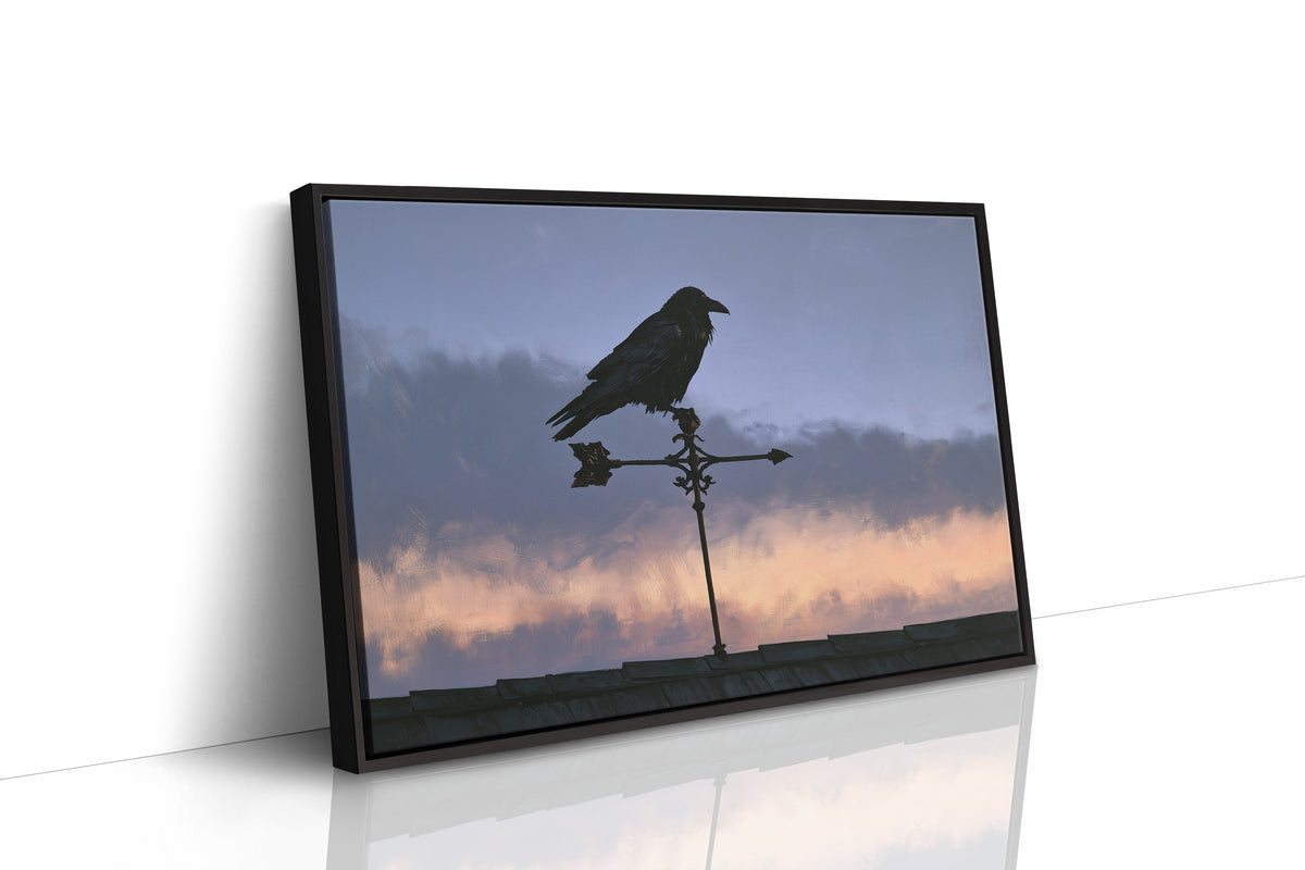 Watcher on the Weathervane, a black raven perched on a weathervane against a dusk sky banded in dusky blue and rose, as a framed canvas in a black frame