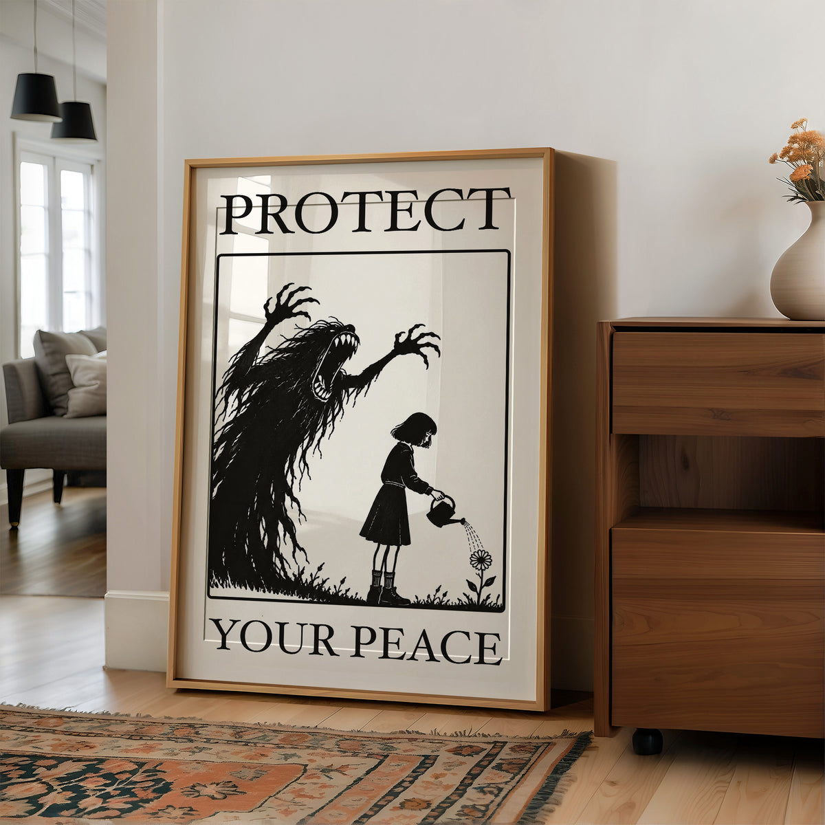 Watering Flowers Beneath a Shadow, a black woodcut style scene of a small girl with a watering can beside a tall shadowy creature with long claws, with the words PROTECT and YOUR PEACE in black serif capitals on cream, in a wood frame on a wall beside a walnut cabinet and an open doorway