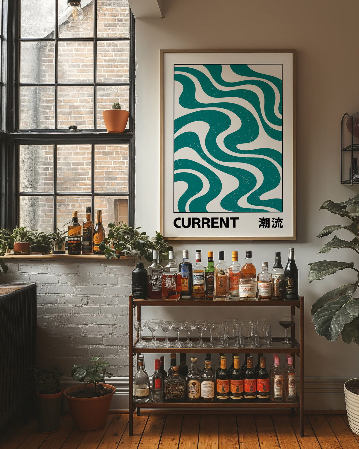 Where the Current Turns Gently, a bold teal wave pattern of stacked curving bands in cream and dark teal, with the word CURRENT in black block letters and a small kanji beside it, in a clean retro poster style, in a wood frame on a brick wall above a bar cart of bottles and potted plants