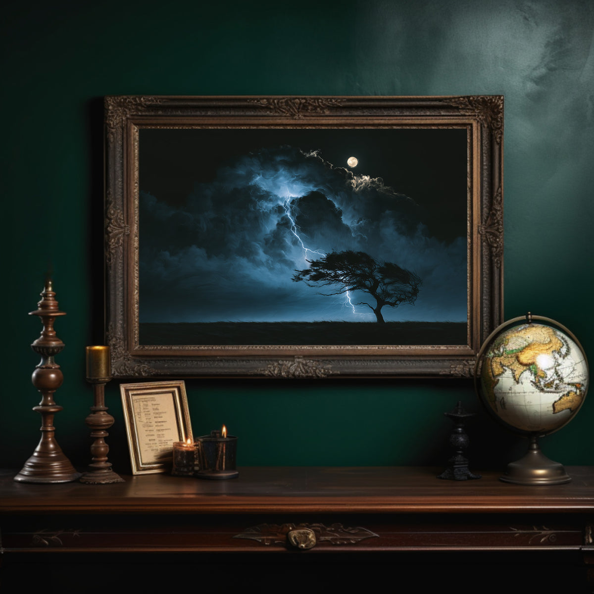 Where the Lightning Keeps Its Distance, lone tree silhouetted under a full moon in blue storm light painting, in an ornate dark frame on a deep green wall above a mantel with a globe and candles