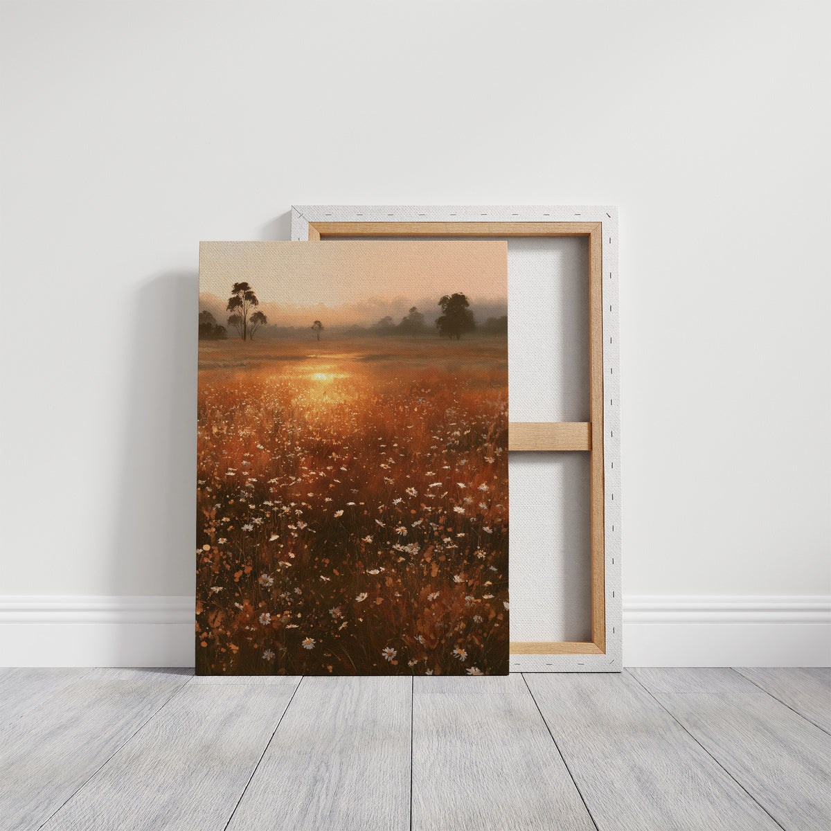 Where the Meadow Holds the Sun, a misty field of wildflowers and grass running toward a low sun, a line of dark trees at the horizon, painted in rust, amber and dusky plum, on a gallery canvas with wrapped edges leaning against a white wall